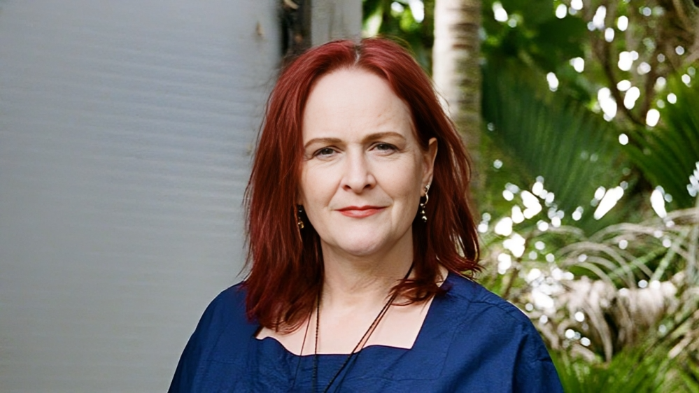 a woman with red hair wearing a blue shirtInternational Society on Thrombosis and Haemostasis
